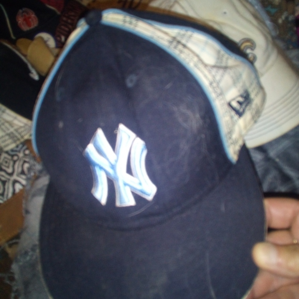 Man's NY baseball cap